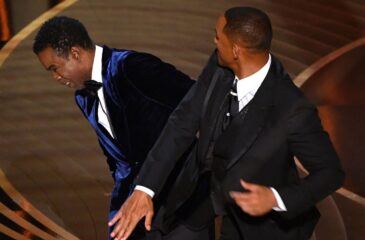 Will Smith läimäisee Chris Rockia. Will Smith palaa Oscar-läimäykseen uudella levyllään!