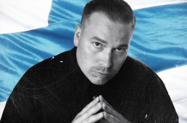 Heikki Kuula ja Suomen-lippu. Heikki Kuulan Isät-levy on keskiluokkaisen rehellinen ja tuore!