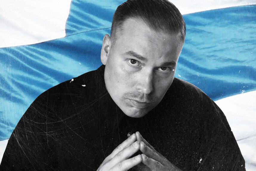 Heikki Kuula ja Suomen-lippu. Heikki Kuulan Isät-levy on keskiluokkaisen rehellinen ja tuore!